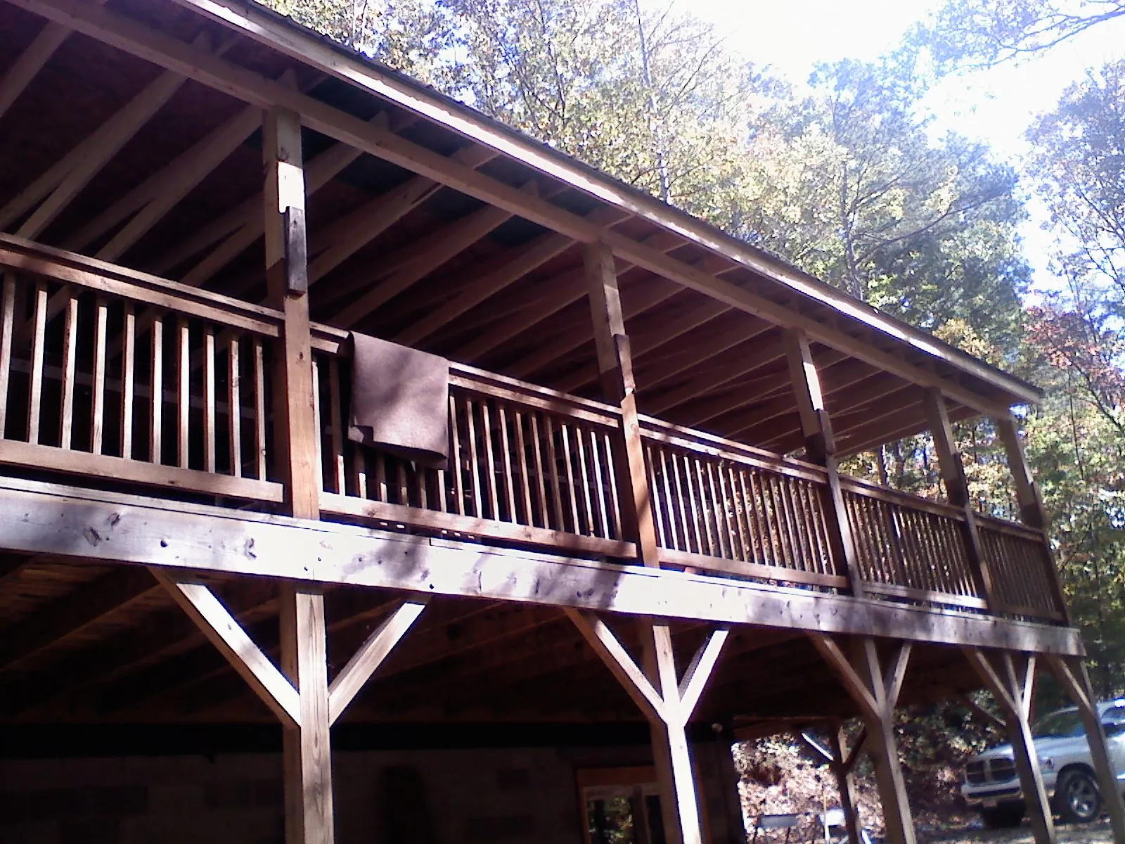 Timber framing under a new elevated porch and deck — Roof Leak Repair in Hubbardston by Roofing Brothers
